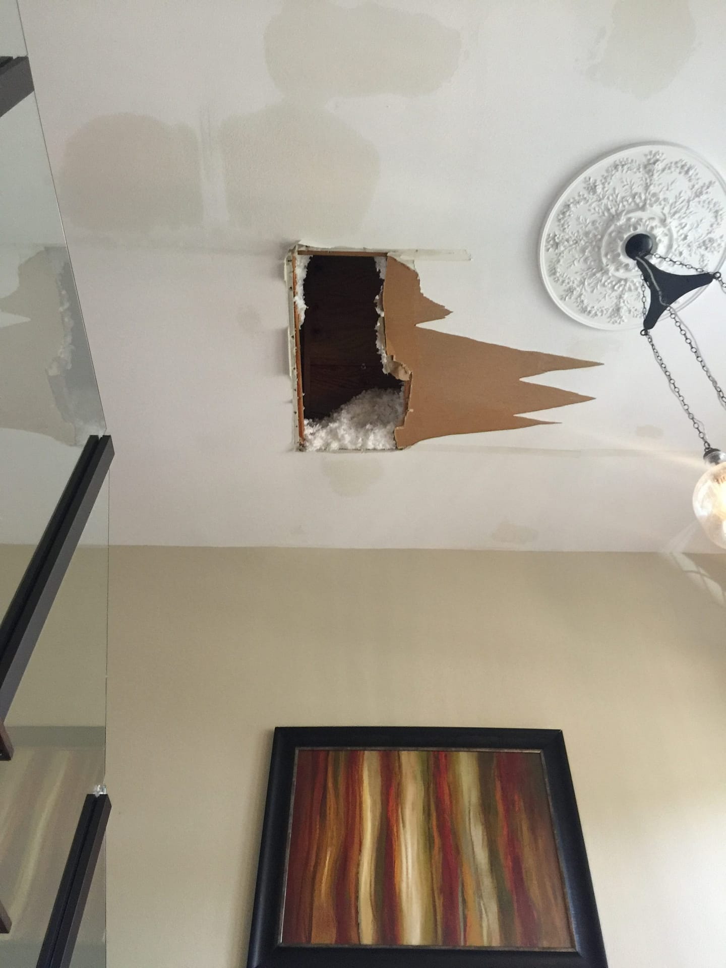 Hole in the ceiling after roof leaked 